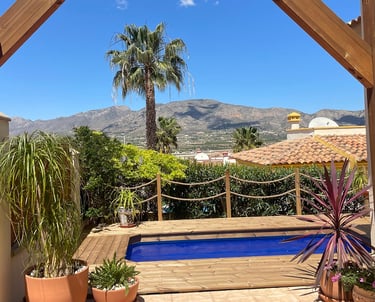 a pool with a wooden deck and a wooden deck