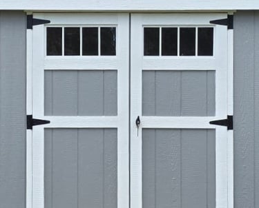 Custom shed door with transom window built in Halifax, Massachusetts showcasing craftsmanship and design.