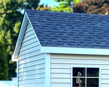 Shed with extended roof overhang built in Massachusetts featuring premium craftsmanship and clean design.