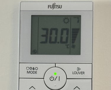 a digital clock on a wall mounted on a wall