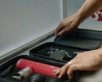 Oyeet NEX Pro portable massage gun for deep muscle relief, providing percussive therapy