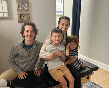 Happy family smiling after gentle chiropractic adjustment in Franklin TN