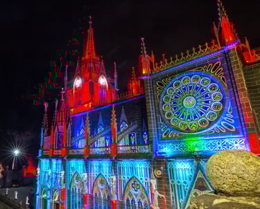 a large building with a projection mapping on it