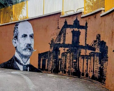 Mural dedicated to Italian historical figures, urban art created by Poliops with warm tones and arch