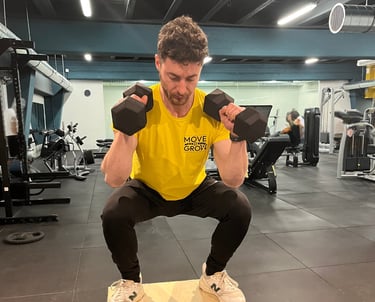 a man in a yellow shirt is doing a box - like thing