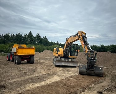 a tractor with a dump truck behind it