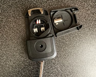#Aftermarket Chevy flip key remote opened – showing battery compartment and buttons