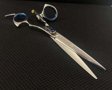 Sharpened pair of scissors being displayed on a mat