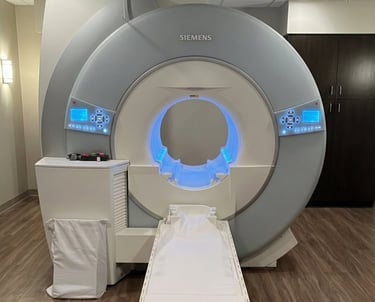Siemens MRI machine used for brain, spine, and neurological imaging in a clinical exam room.