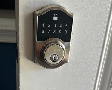 residential locksmith rekeying a door lock at a home in Volusia County
