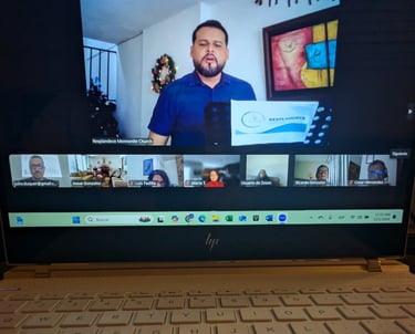a laptop computer screen showing a video chat with a man on the screen