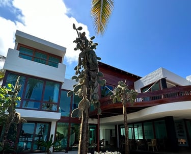 Exterior view of Villa Escalesia Galápagos, a contemporary oceanfront boutique hotel surrounded by n