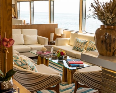 Refined yacht interior lounge with panoramic sea views, showcasing comfort and design