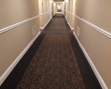 Professional deep steam cleaning results on a high-traffic hotel hallway carpet in Cumberland, RI, p