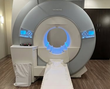 Siemens MRI machine used for brain, spine, and neurological imaging in a clinical exam room.