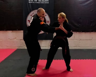 a man and woman doing a karate pose