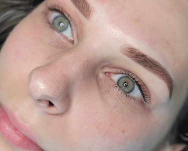 Close-up of beautiful powder or Ombre brow on a client