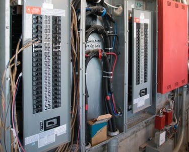 An electrical panel being expertly serviced