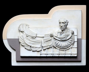 Small ceramic wall sculpture of fragmented winged figure suggestive of a Greek or Roman general.