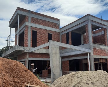 Suasana Renovations building two-story house structure and construction services.