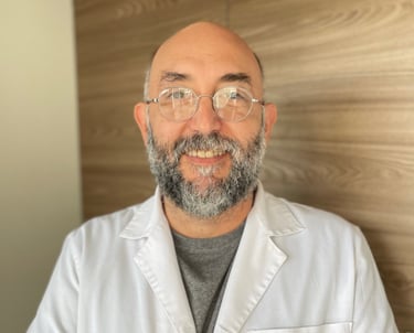 a man in a lab coat and glasses
