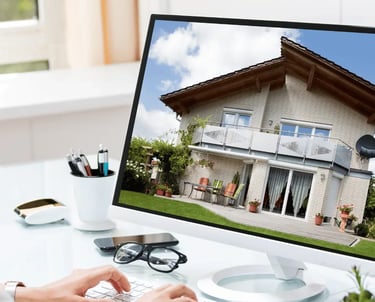 Computer screen showing HDR real estate photo of house exterior