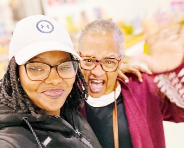 a woman with glasses and a hat on a white background