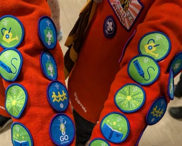 Two Squirrels show their many badges from the 25th Allerton Scout group