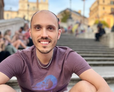 a man sitting on a staircase in front of a crowd of people