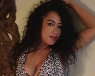lady posed with arm raised and hand touching head