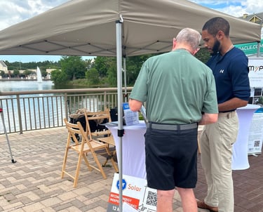 a man and a consultant standing in front of a tent