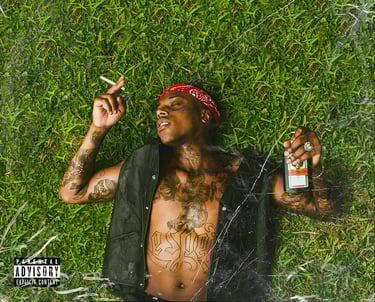 a man with tattoos on his chest and a cigarette