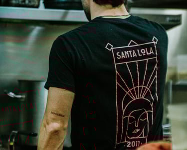 Santa Lola chef working in corporate t-shirt
