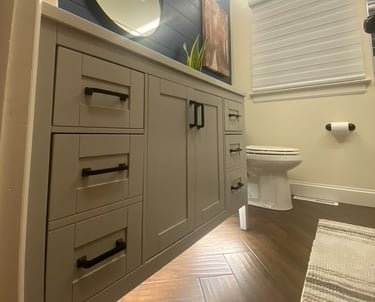 white vanity bathroom remodel with herringbone wood look tile and shiplap accent wall