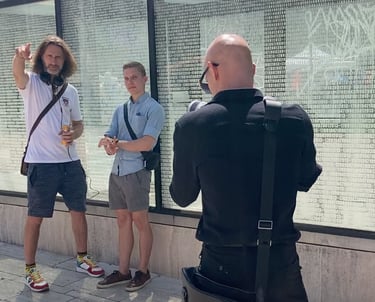 a man recording a video of a man who is presenting for his youtube video