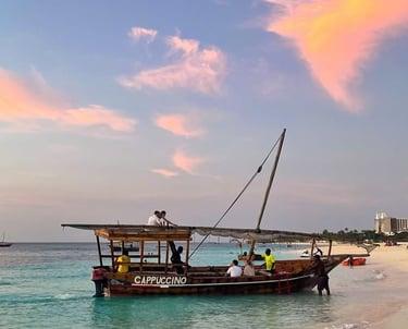 Traditional dhow cruise sailing along the turquoise waters of Zanzibar under a clear sky