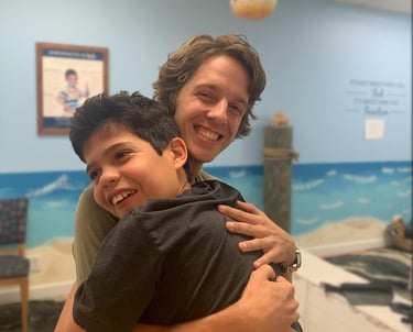 Chiropractor working with special needs to help with speech and motor delays