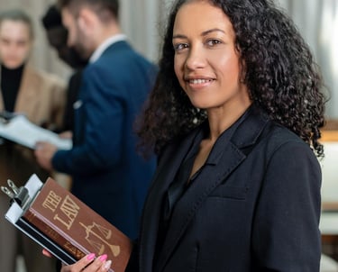 A lady holding a book about a law