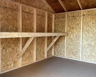 Custom shed with interior workbench built in Massachusetts and Rhode Island for added functionality.
