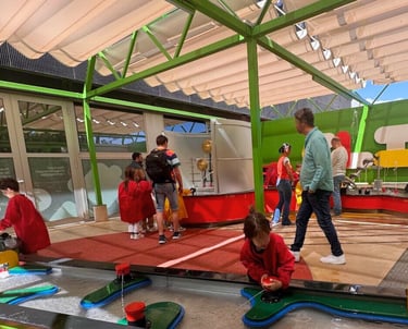 young kids playing with water toys in a Clik play area at CosmoCaixa museum in barcelona