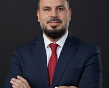 a man in a suit and tie with a red tie