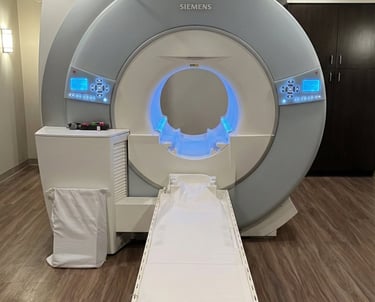 Siemens MRI machine used for brain, spine, and neurological imaging in a clinical exam room.