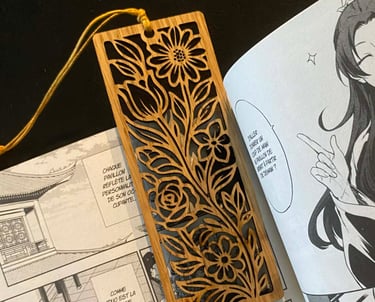 a person holding a book with a bookmark