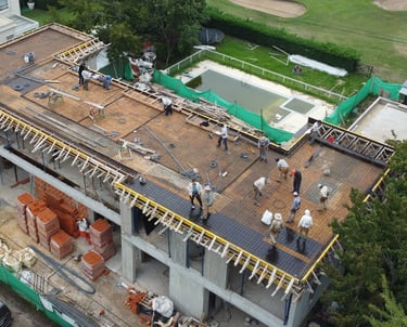 a group of people standing on top of a building