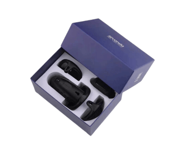 a picture of a black chastity cage with accessories in the box the picture is taken from above