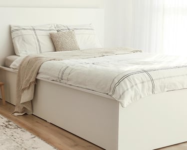 clean bedroom and made bed