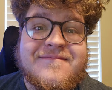 a man with a beard and glasses on his head