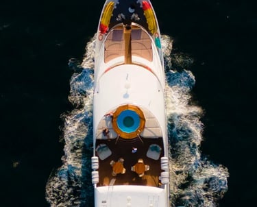 Luxury expedition yacht navigating pristine ocean waters, offering boutique cruise experiences