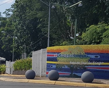 a bus stop sign on a street corner
