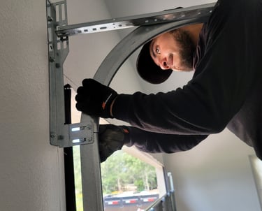 Alejandro repairing a garage door | On Point Overhead Doors - Kyle, TX